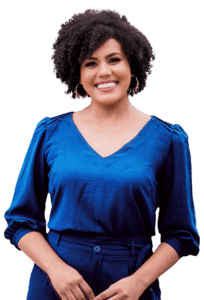 Insurance agent smiling in professional blue attire for Spokane insurance services.