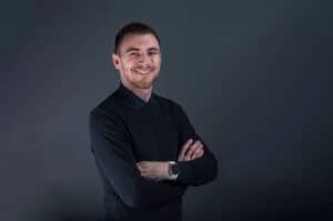 Smiling male insurance agent in professional attire representing Boyd Insurance in Spokane, WA.