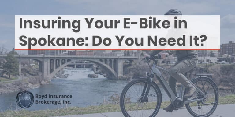 E-bike rider crossing Spokane bridge, highlighting the importance of e-bike insurance in Spokane, WA.